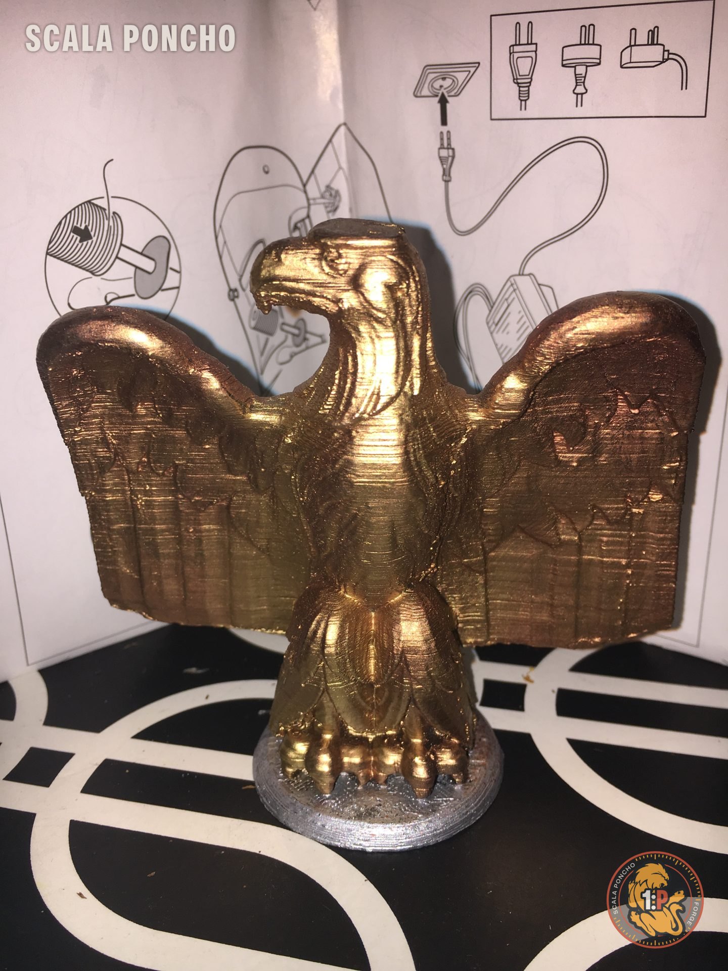 Eagle with spread wings 3D printed and painted gold on a silver base