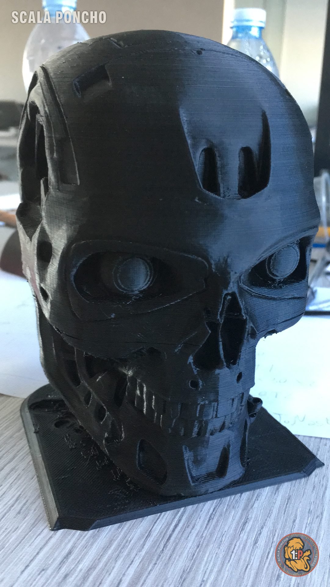 T-800 skull 3D printed in black filament, with visible print lines